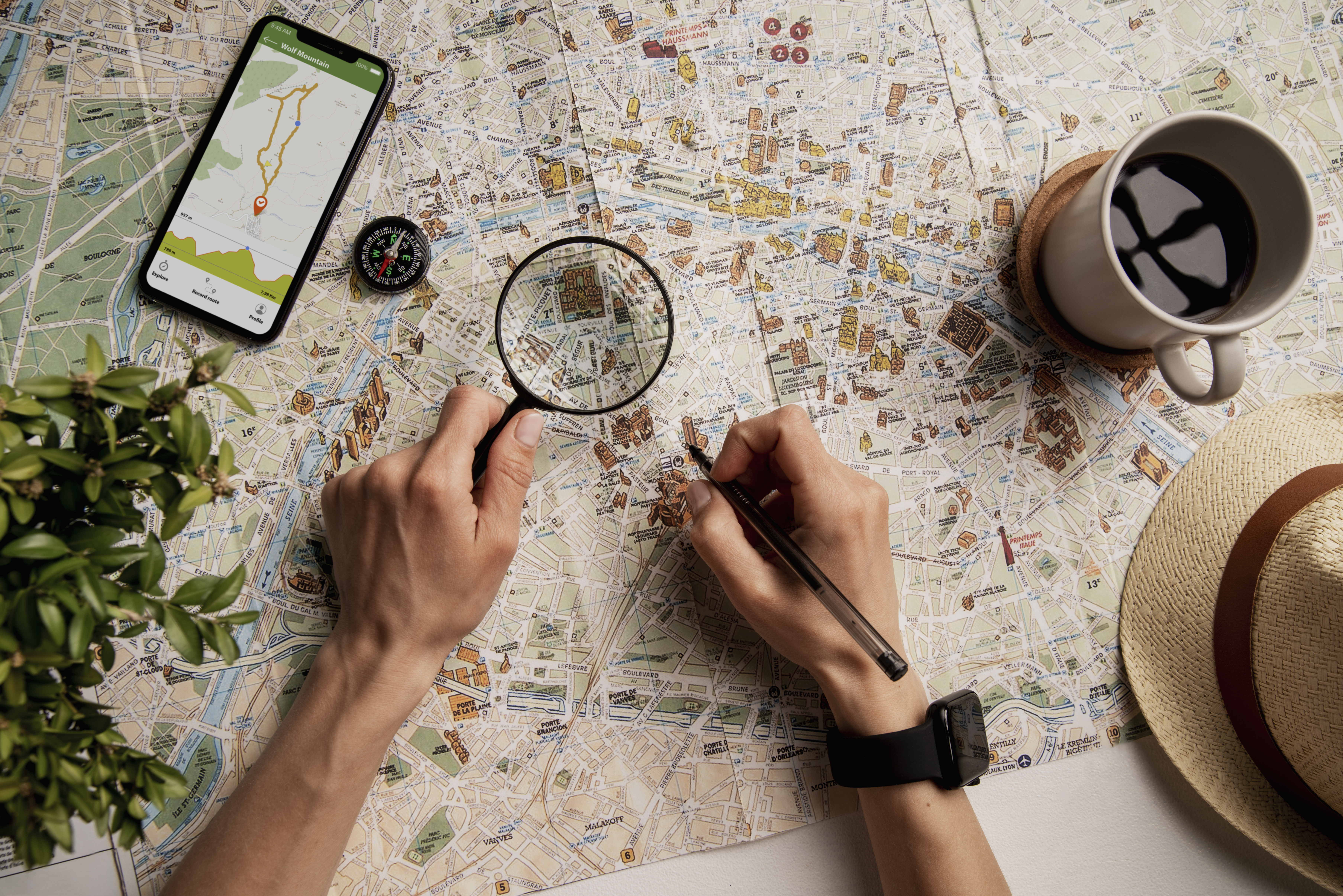 view-person-using-world-travel-map-with-magnifying-glass